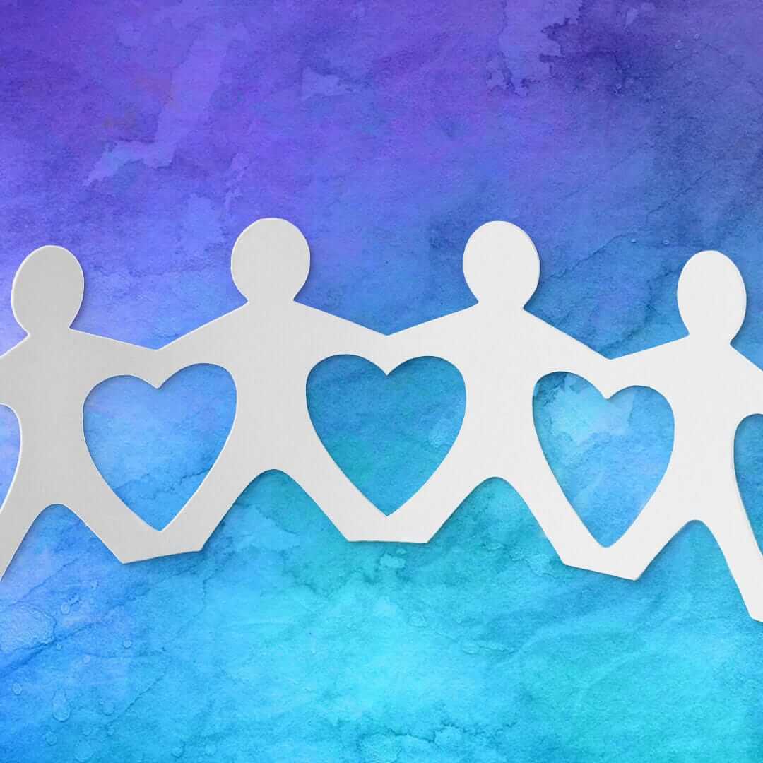 Giving Back hand holding paper cutouts